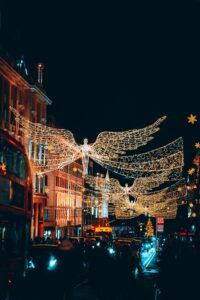 Illuminate the festive spirit with stunning angel light decorations on London streets at night.